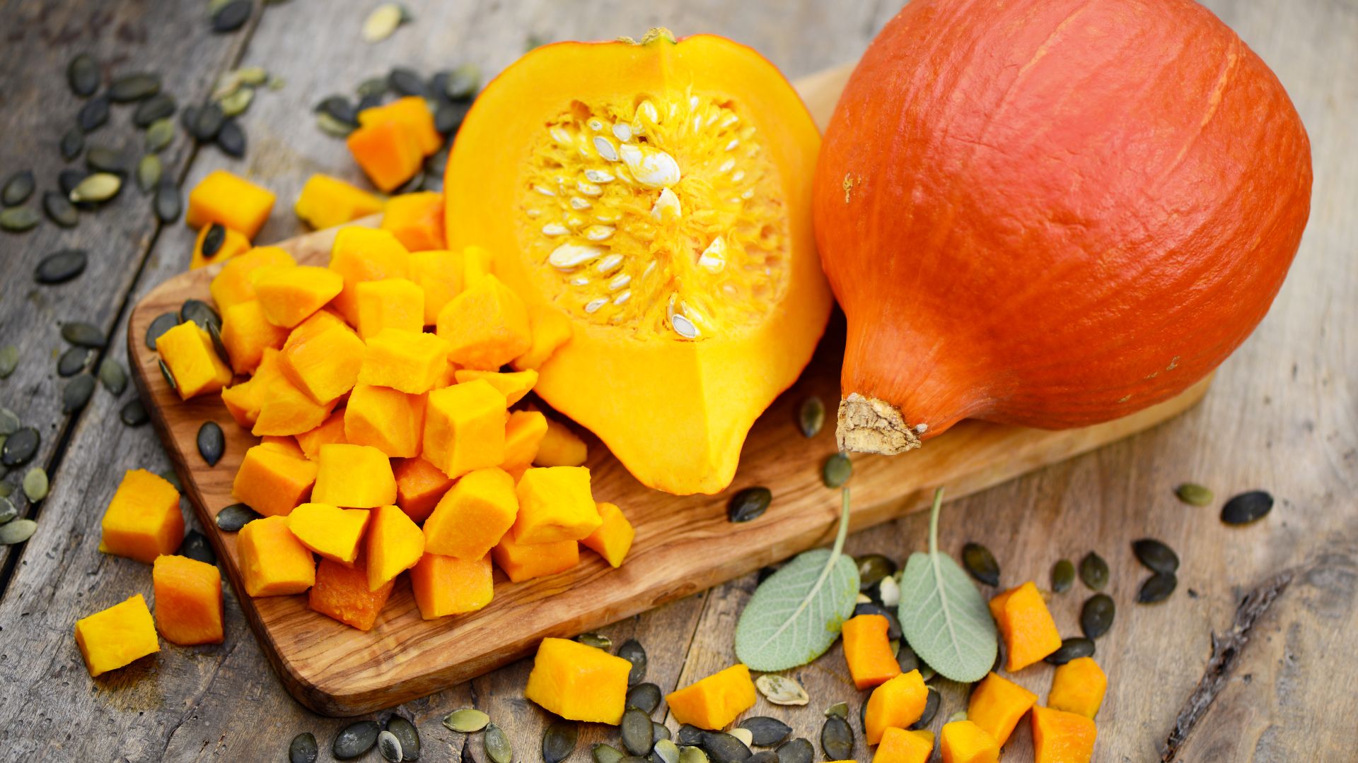 Sliced Hokkaido pumpkin on a wooden board