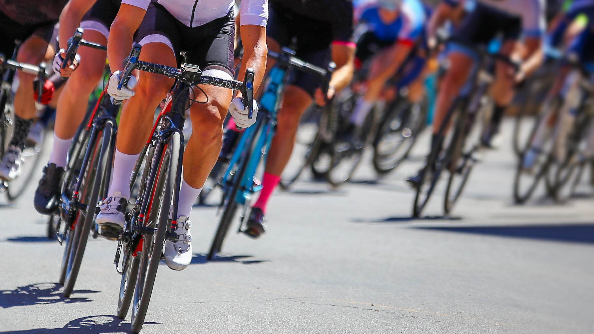 Several cyclists in a race on the road