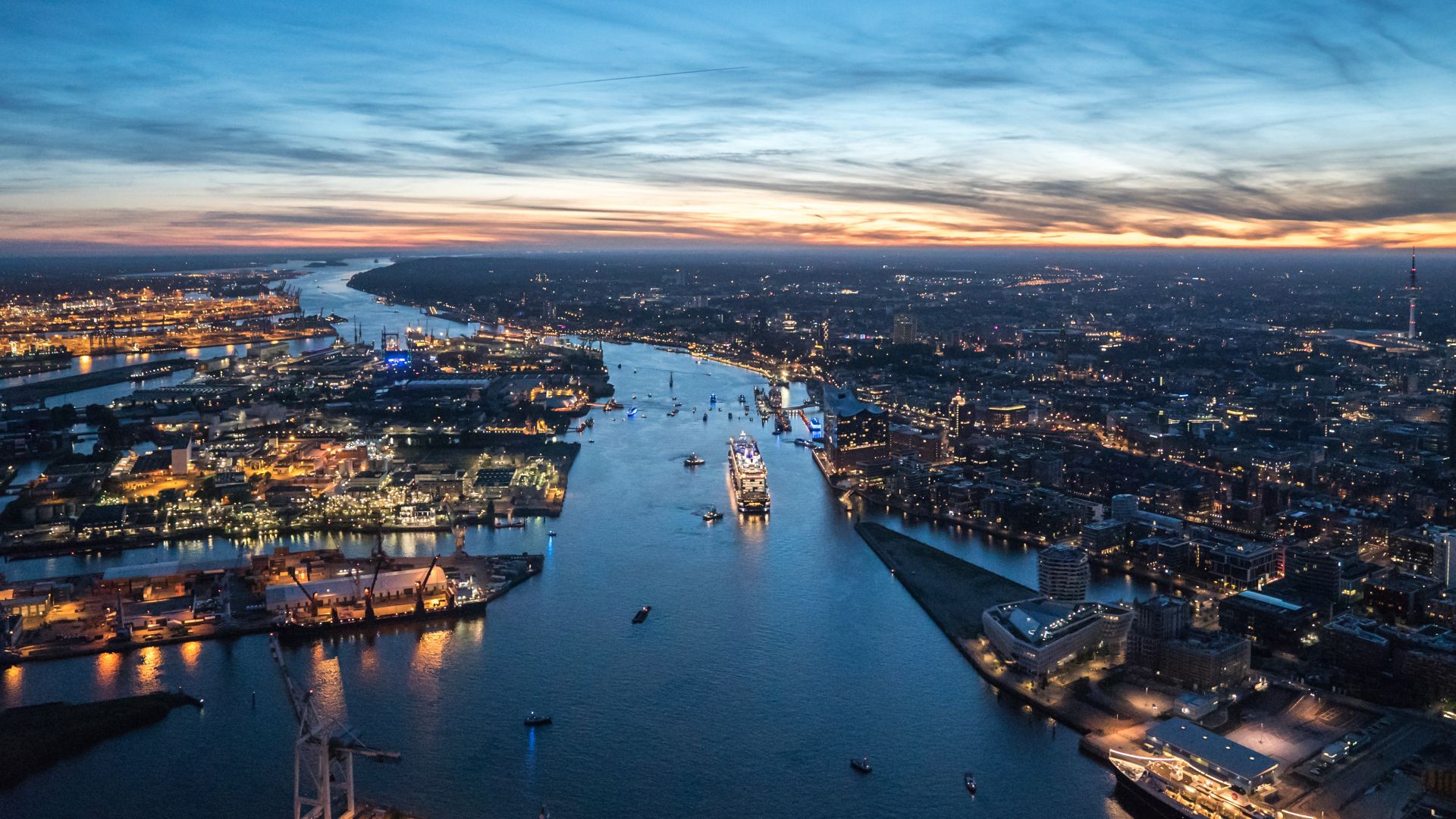 Hamburg: harbour with cruise liner AIDA on the river Elbe, evening light, aerial view