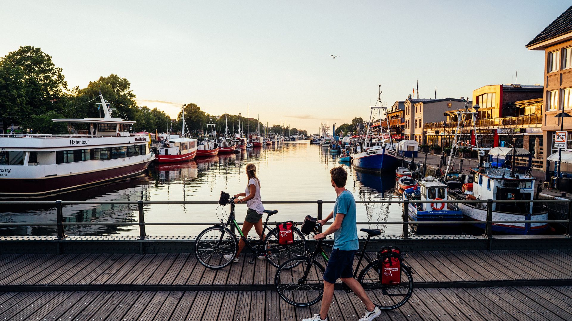 Rostock: Cyclists on the old river at Warnemünde